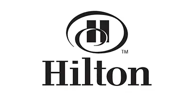Hilton logo with stylized 'H' and brand name.